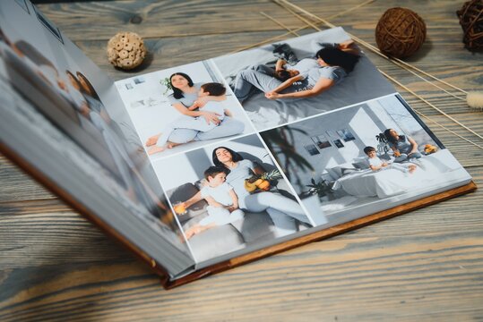 Luxury wooden photo book on natural background. Family memories photobook. Save your summer vacation memories.