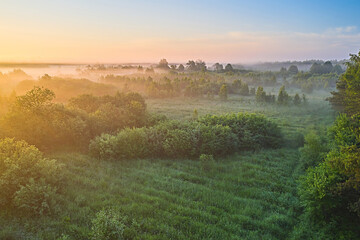Middle Summer Nature Of Europe. Amazing Sunrise Over Misty Landscape. Scenic View Of Foggy Morning Sky With Rising Sun. Middle Summer Nature Of Europe