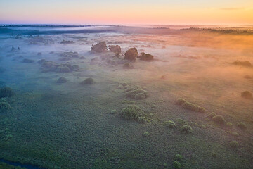 Amazing Sunrise Over Misty Landscape. Scenic View Of Foggy Morning Sky With Rising Sun Above Misty Forest. Middle Summer Nature Of Europe