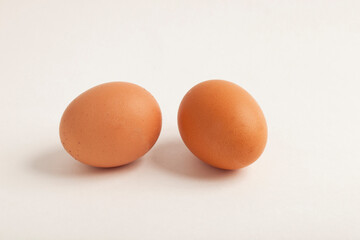 Chicken egg, brown in color.