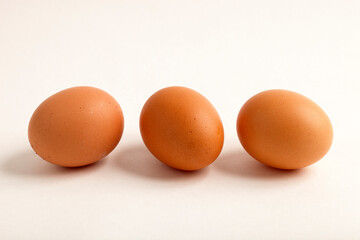 Chicken egg, brown in color.
