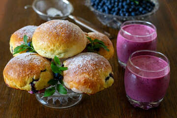 Homemade buns with blueberry filling, blueberry cocktail