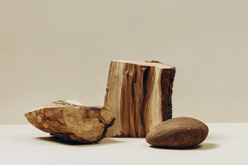 Natural materials stone and wood on a beige background, a natural background for your product....