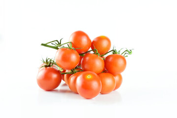 Group of cherry tomatoes on branch, on white background.