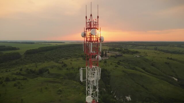 Telecommunication tower 5G. Telecom tower antenna and satellite transmits the signals of cellular 5g and 4g mobile signals - Powered by Adobe