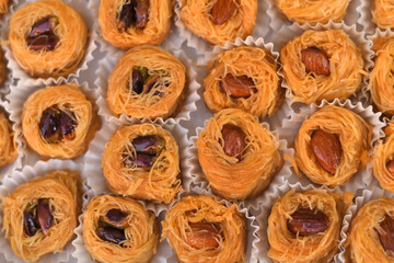 Baked pastry dessert on the table, with white paper wrap