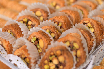 Baked pastry dessert on the table, with white paper wrap