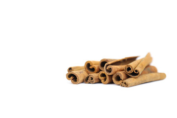Cinnamon sticks isolated on white background with copy space. Closeup, cinnamon sticks a lot, front view.