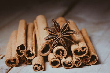 Traditional Christmas spices - Star anise with cinnamon and cloves Macro on brown wooden table