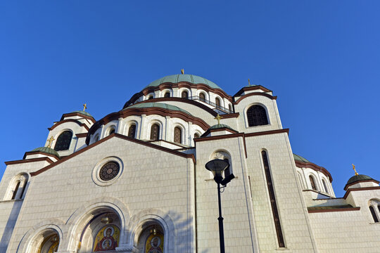 The Temple of Saint Sava (Sveti Sava) - Serbian Orthodox church with clear blue sky in the background. Shot in day time during the golden hour.