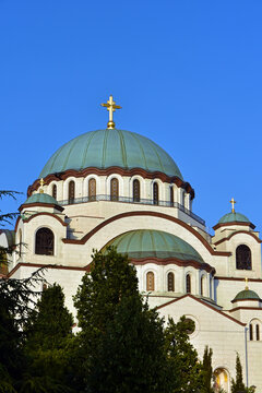 The Temple of Saint Sava (Sveti Sava) - Serbian Orthodox church with clear blue sky in the background. Shot in day time during the golden hour.