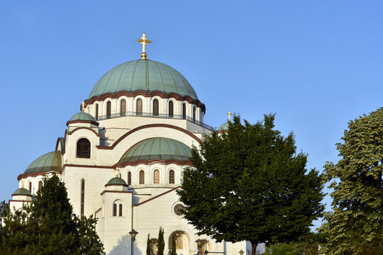 The Temple of Saint Sava (Sveti Sava) - Serbian Orthodox church with clear blue sky in the background. Shot in day time during the golden hour.