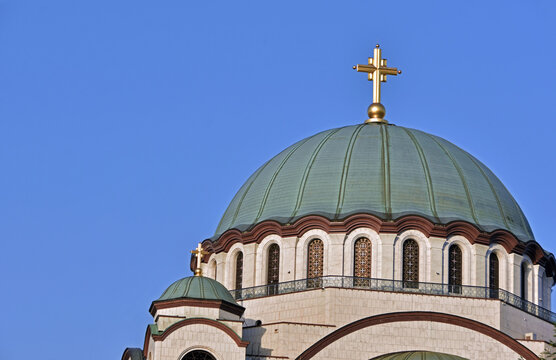 The Temple of Saint Sava (Sveti Sava) - Serbian Orthodox church with clear blue sky in the background. Shot in day time during the golden hour.
