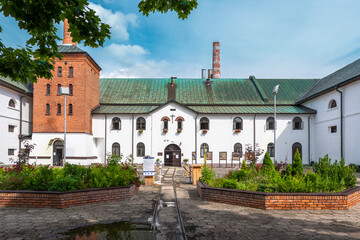 Fototapeta na wymiar Yard of an old, traditional brewery in Zwierzniec, Poland. Monumental industrial building.