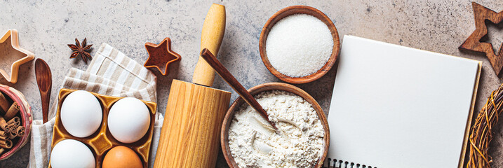 Christmas baking concept. Ingredients for Christmas cookies on a dark background, copy space.