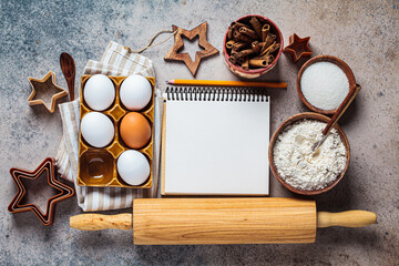 Christmas baking concept. Ingredients for Christmas cookies on a dark background, copy space.