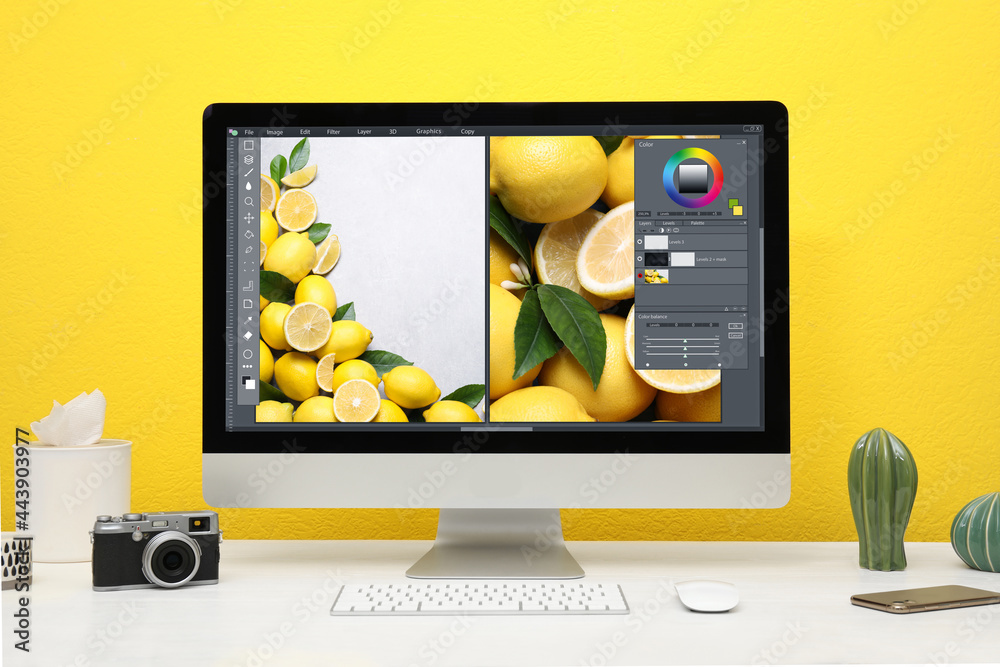 Fototapete Designer's workplace. Computer with photo editor application on table