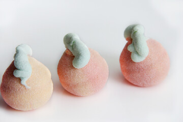 Marshmallow in a glass vase on a white background. Marshmallows in the form of different figures in a vase.Candys