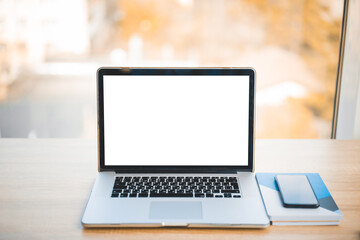 Fototapeta premium Mockup laptop on the table with empty blank screen. Modern technology concept, corporate portfolio or advertisement design on computer devices