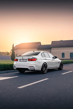 White BMW M3 F80 on the background of beautiful sunset. Kyiv, Ukraine - June 2021.