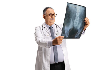 Mature male doctor examining an x ray scan