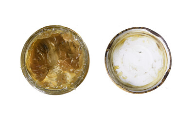 Machine grease in a glass jar. Material for lubricating machine parts used in the workshop.