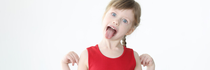 Little girl in red dress showing tongue © megaflopp