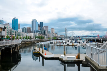 Fototapeta na wymiar Seattle dock view on the city. Seattle downtown waterfront view on the city buildings.