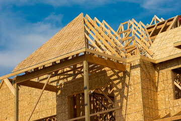 Obraz premium Different views of spacious 2 story wood frame luxury home under construction.