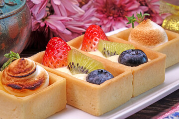 Mini mixed fruits tart for Christmas and New year party. Best choices of Christmas desserts