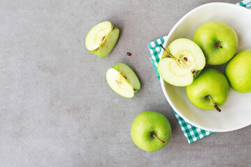 Flat lay composition of fresh ripe green apples on marble table, space for text