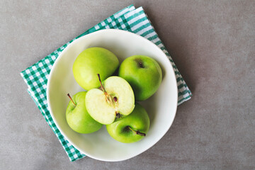 Flat lay composition of fresh ripe green apples on marble table