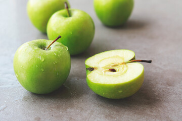 fresh ripe green apples on marble table