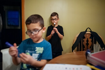 Practicing a musical instrument. 