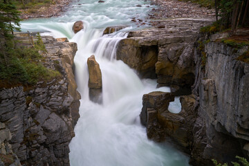 Sunwapta Falls Jasper National Park Alberta. Water pours over Sunwapta Falls. Jasper National Park. Alberta, Canada.

