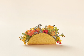 Taco with flowers, twigs and berries