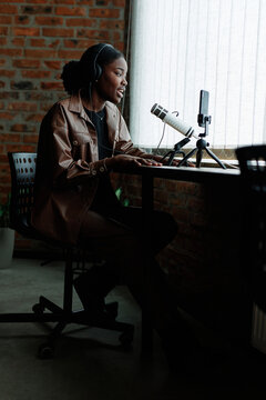 Woman recording podcast remotely 