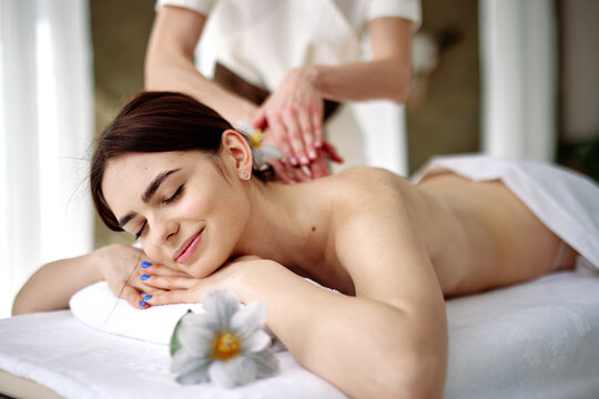 Female client having appointment with masseur 