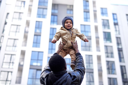 Kid enjoying modern architecture with father 