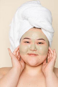 Portrait Of Asian Woman Doing A Skincare Treatment