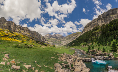 Monte Perdido and Ordesa valley with river and waterfall in the spanish national park Ordesa y...