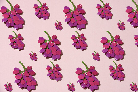 Pattern with grapes. Fruit made of paper.