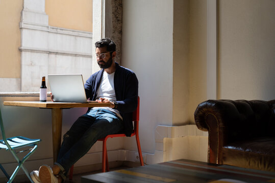 Retro cafeteria and a man sitting at the table working