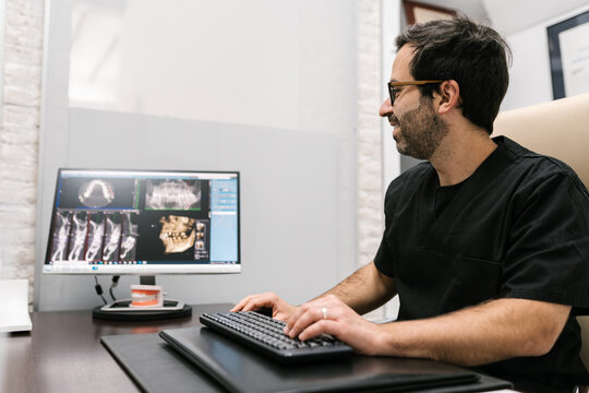 Dentist Showing X-Ray in his Office