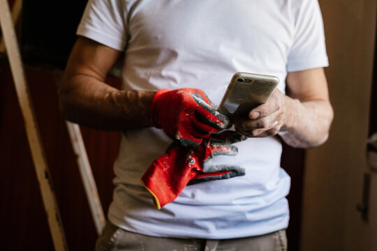 Unrecognized Bricklayer Using Phone