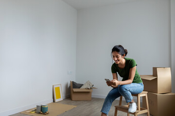 Indian woman texting with her phone 