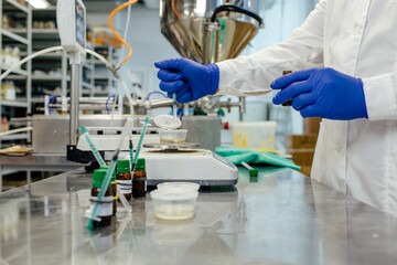 Scientist working in laboratory at cosmetics factory