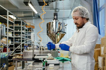Scientist working in laboratory at cosmetics factory