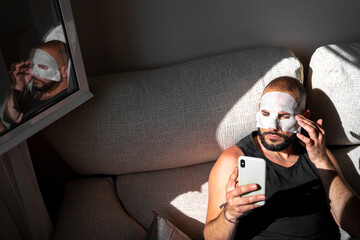 Modern man with a facial mask