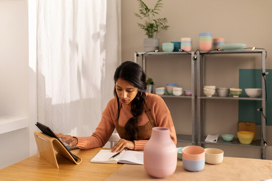 Young woman working at online shop